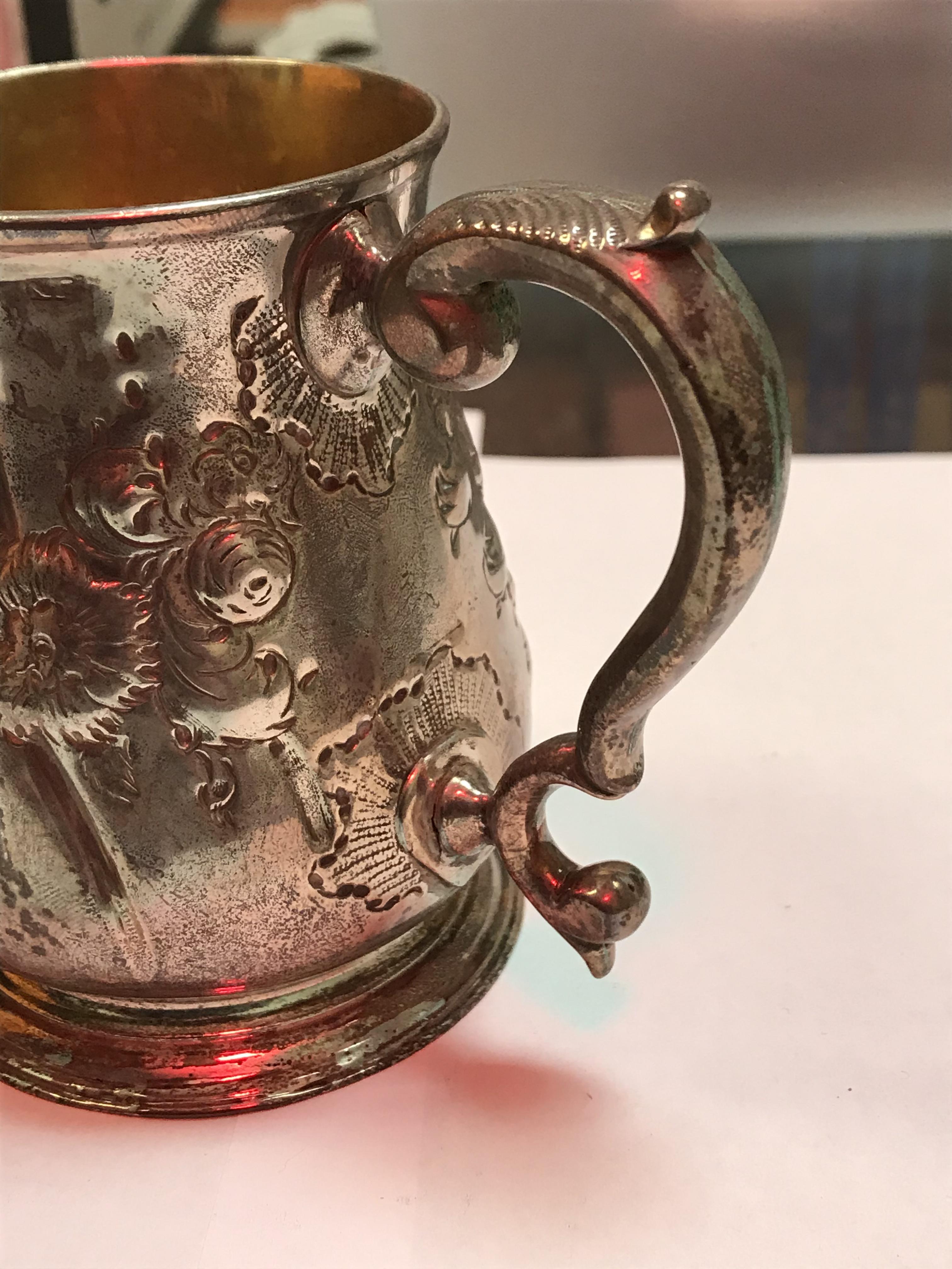 A George II silver baluster shaped mug with later foliate engraved decoration, - Image 23 of 42