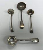 A pair of William IV Scottish silver "King's" pattern sauce ladles,