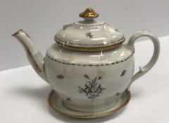 A circa 1800 monochrome and gilt decorated teapot and cover on stand,