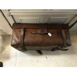A large leather trunk bearing "Finnegan's of Bond Street London" to interior,