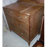 An oak chest of three drawers in the manner of Heal's,
