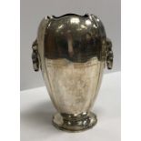 A George IV silver trophy cup of elongated squash form with two swing handles,