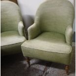 A pair of modern tub chairs with lime green upholstery,