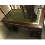 A modern mahogany double pedestal desk, the top with tooled and gilded leather insert,