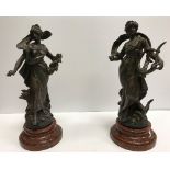 A pair of Spelter figures and AFTER LOUIS MOREAU "Muse Champêtre and Seinter Fleuri" 37 cm high