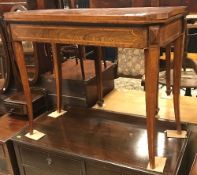 An early 19th Century rosewood and cross-banded fold-over card table on square tapered splayed