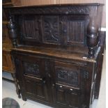 A Victorian oak court cupboard with carved decoration in the 17th Century manner,