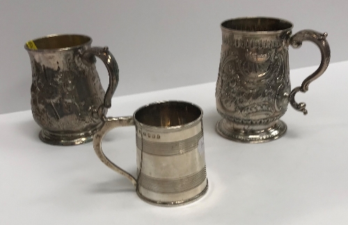 A George II silver baluster shaped mug with later foliate engraved decoration,
