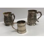 A George II silver baluster shaped mug with later foliate engraved decoration,
