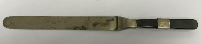 A 19th Century Chinese paperknife with jade and white metal banded handle and white metal blade,