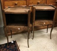 A pair of 20th Century mahogany bedside tables in the Louis XV manner,