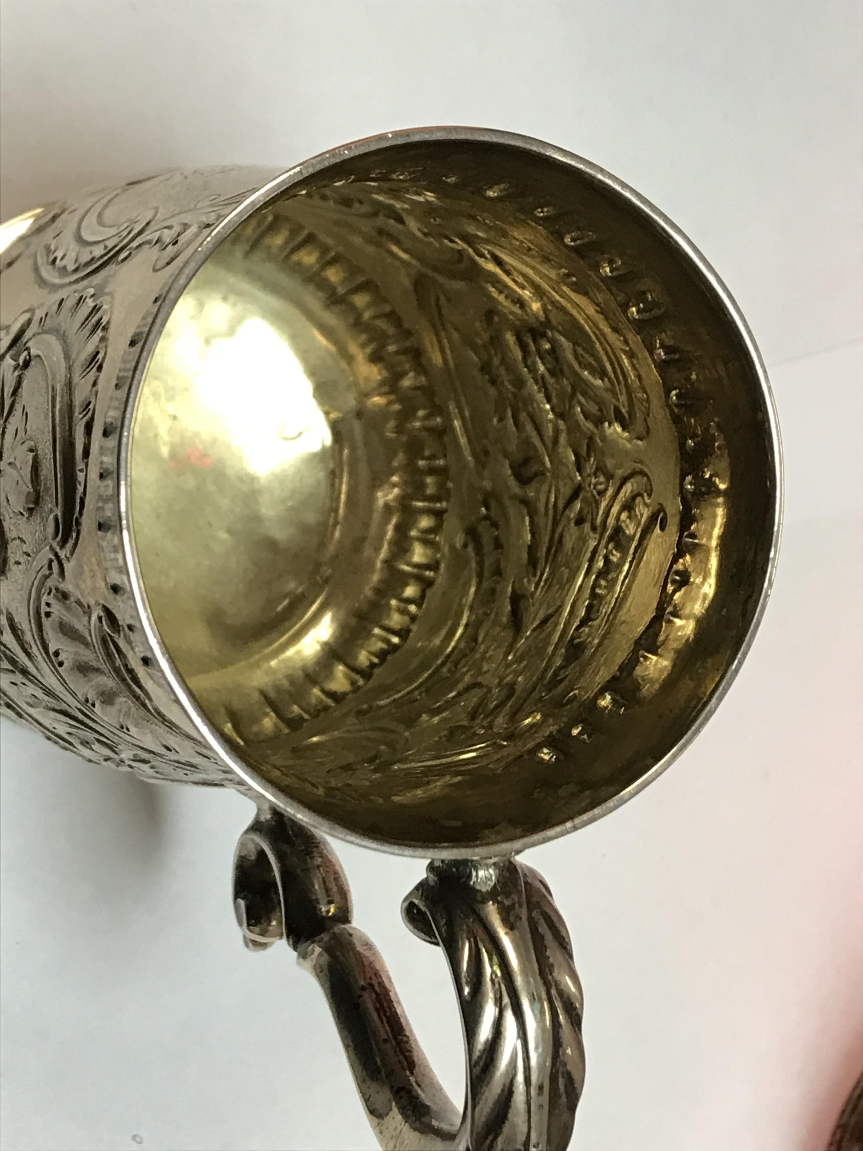 A George II silver baluster shaped mug with later foliate engraved decoration, - Image 11 of 42