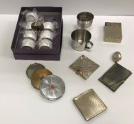 A collection of silver and other powder compacts, oval pill box, two modern beakers,