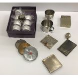 A collection of silver and other powder compacts, oval pill box, two modern beakers,