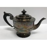 A late Victorian silver teapot of urn form,