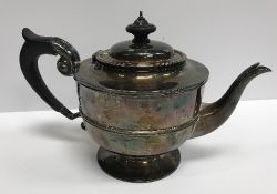 A late Victorian silver teapot of urn form,