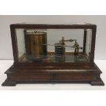 A circa 1900 oak and glazed cased barograph in the manner of Negretti & Zambra, with slim drawer,