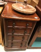 A 19th Century mahogany slim chest of drawers, the plain top above four short drawers,