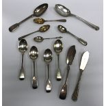 A set of four Victorian "Fiddle" pattern teaspoons, a pair of engraved and embossed fruit teaspoons,