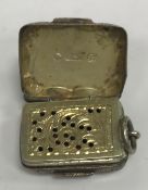 A Victorian silver vinaigrette of rectangular form with foliate engraved decoration,