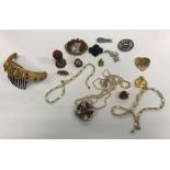 A box of various costume jewellery to include a Berlin style porcelain brooch as mother and child,