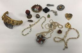 A box of various costume jewellery to include a Berlin style porcelain brooch as mother and child,