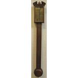 A modern oak cased stick barometer with brass dial and alcohol thermometer