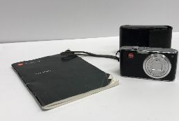 A Leica C-Lux I camera with leather case and instruction manual