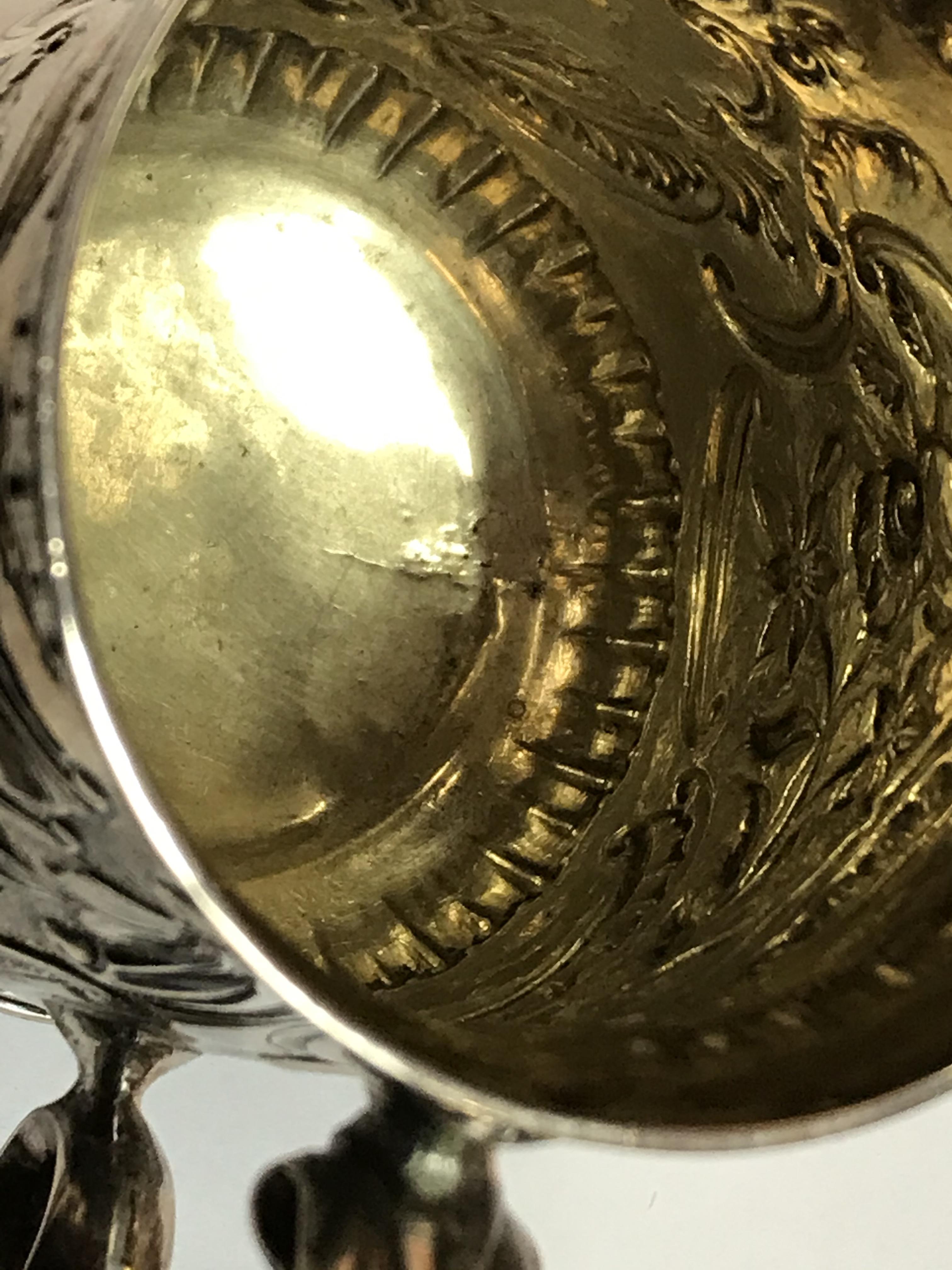 A George II silver baluster shaped mug with later foliate engraved decoration, - Image 13 of 42