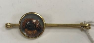 An un-marked yellow metal mounted Essex crystal brooch as a Pekinese,