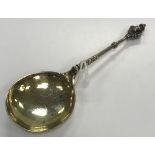 A Norwegian cherub's head spoon with scroll engraved gilt-washed bowl (marks verso rubbed,