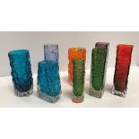 A collection of Whitefriars glassware including two tangerine orange bark vases,