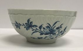 An 18th Century Worcester cabbage leaf design bowl with blue floral spray decoration,