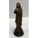 A 19th Century carved boxwood and ivory mounted figure of a woman in robes,