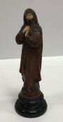 A 19th Century carved boxwood and ivory mounted figure of a woman in robes,