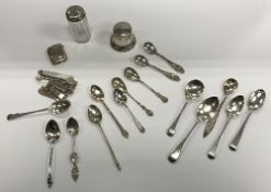 A collection of various small silver wares to include thirteen various spoons, engraved vesta case,