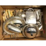 A containing box of assorted plated wares to include various cutlery, two lidded tureens, etc.