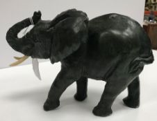 A Shona Zimbabwe verdite sculpture of a bull elephant, 23 cm long x 15.