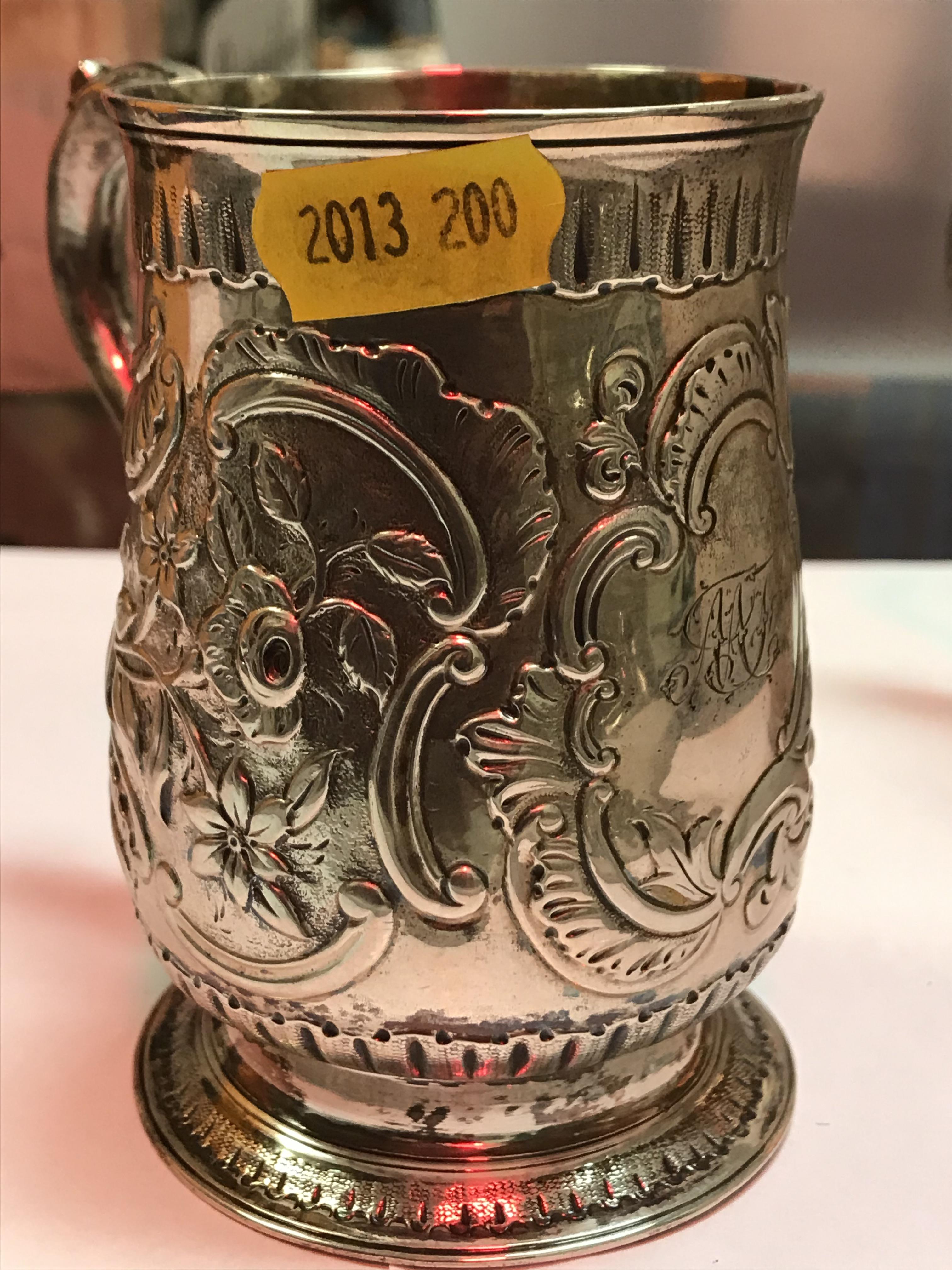 A George II silver baluster shaped mug with later foliate engraved decoration, - Image 6 of 42