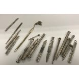 A collection of various silver and white metal mounted propelling pencils, silver cased pencils,