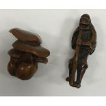 A 19th Century Japanese Meiji period carved boxwood netsuke as a group of five mushrooms,