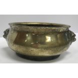 A Chinese bronze censer with stylised lion mask handles bearing faux Qianlong four character mark