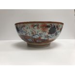 A Chinese polychrome decorated bowl set with flowers and insects, 29.