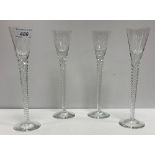 A set of twelve glass liqueur glasses on long rope-twist stems to circular foot,