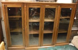 A circa 1900 mahogany breakfront glazed bookcase with adjustable shelves, 213.