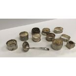 A collection of eight various silver napkin rings, a silver snooker chalk holder (incomplete),