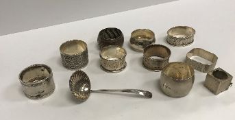 A collection of eight various silver napkin rings, a silver snooker chalk holder (incomplete),