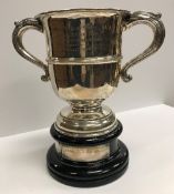 A George V silver two-handled trophy cup of inverted bell form,