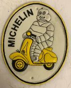 A modern painted cast iron sign inscribed "Michelin", approx 24.