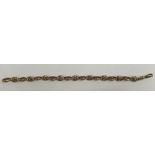 A Victorian 10 carat gold fancy chain link bracelet with stylised eye links, 24 cm long,